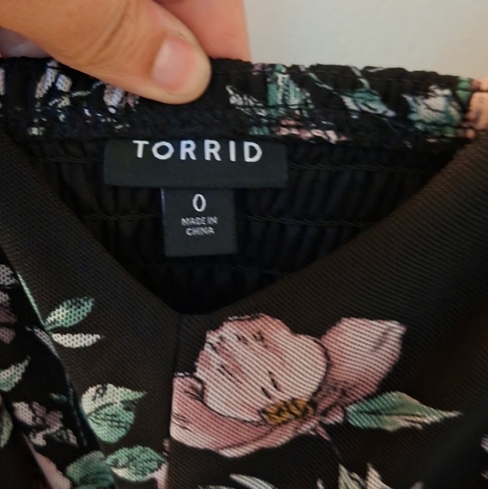 This is a Torrid black floral wide leg challis jumpsuit with a mesh overlay on t - Picture 5 of 5